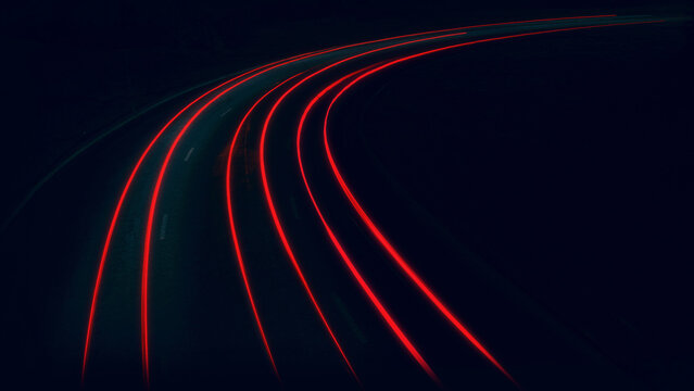 the trail of car lights on the night road, the bend of the night highway