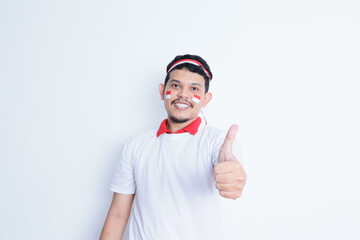 Indonesian man showing excitement with thumbs up when celebrating independence day