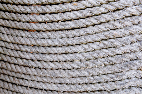 Background of sea ropes laid out in a row close-up