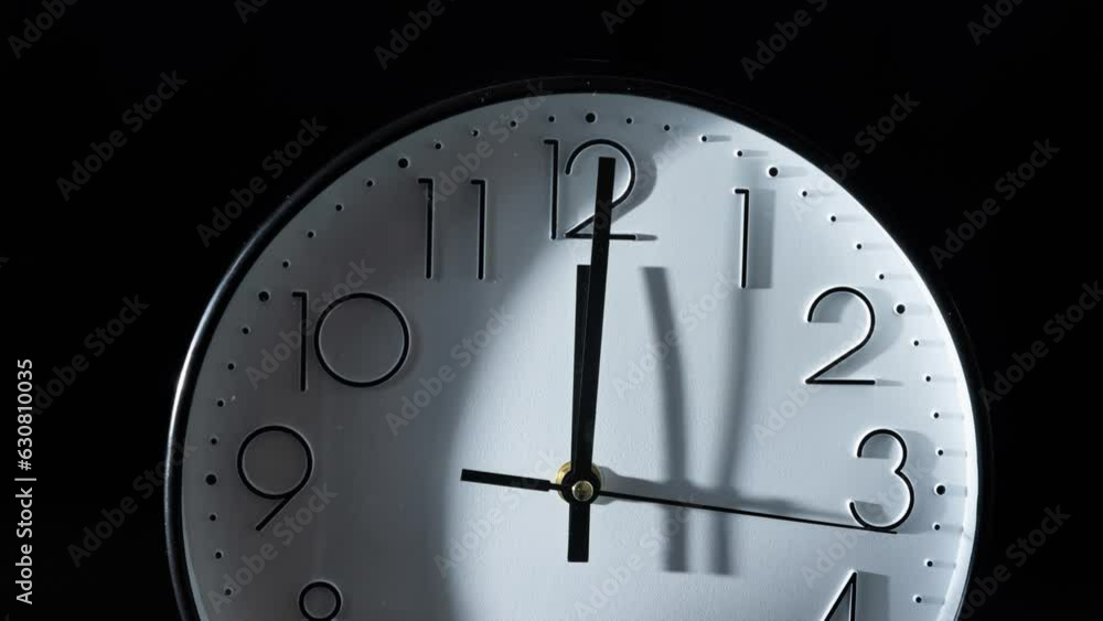 Poster time lapse of an analog clock moving clockwise against black background