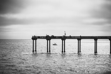 Boat Passing a Pier