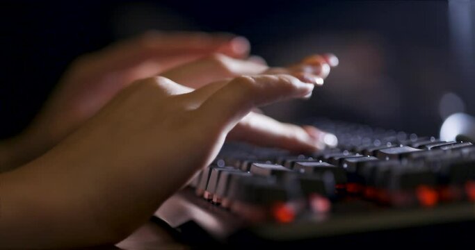 Female hand typing on black keyboard
