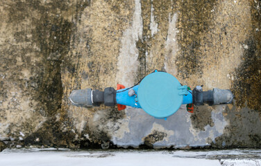 Closeup of the water meter is closed by the plastic cover.