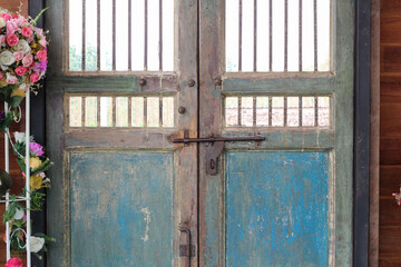 Old lock with latch on the old wooden door