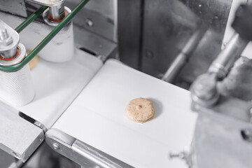 Sweets candy on industry conveyor. Modern production line of factory chocolate