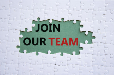 Join our team symbol. White puzzle with words Join our team. Beautiful grey green background....
