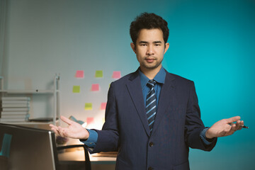 Young Asian businessman talking on the phone
late night hustle ambitious Working overtime talking...