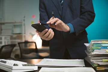 Young Asian businessman talking on the phone
late night hustle ambitious Working overtime talking...