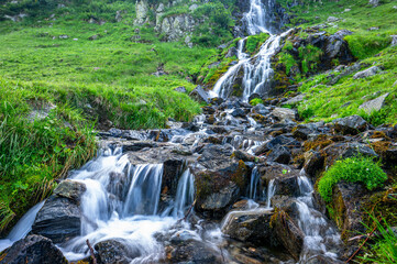 Fototapeta premium Waterfall in Fagaras Mountains, Romania.
