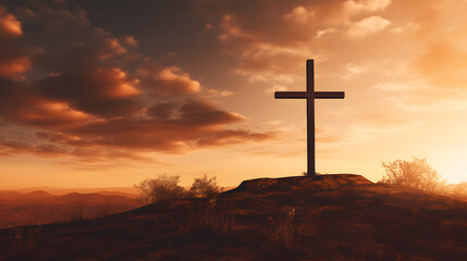 Silhouette of Cross at sunrise on cliff and mountains