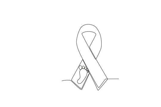A ribbon with a picture of a baby's feet. Pregnancy and infant loss awareness month