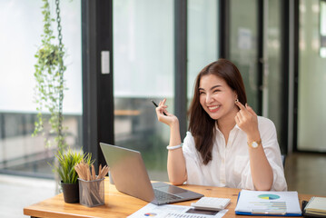 Fototapeta premium businesswomen offer works through online conferences on labtop, Remote work and communication