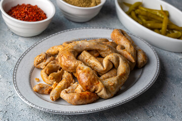 Traditional delicious Turkish cuisine, Middle Eastern dishes, offal dishes, stuffed sheep intestines (Turkish name; Mumbar dolmasi)