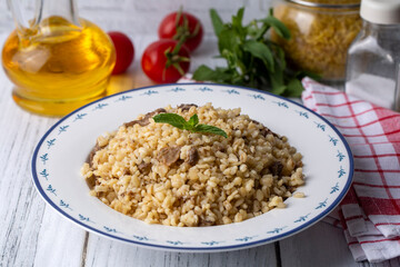 Bulgur pilaf with mushrooms, food concept photo.