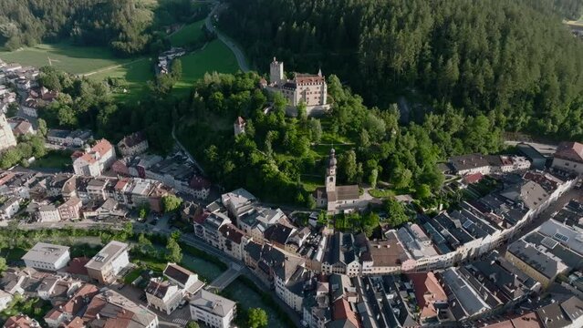 Aerial Drone shot of Brunico or Bruneck, a small town in South Tyrol. Evening time in Italian Alps Alto Adige