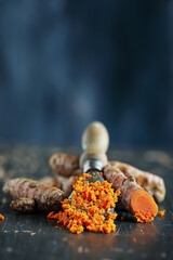 Freshly ground turmeric root containing curcumin, an anti-inflammatory and antioxidant substance....