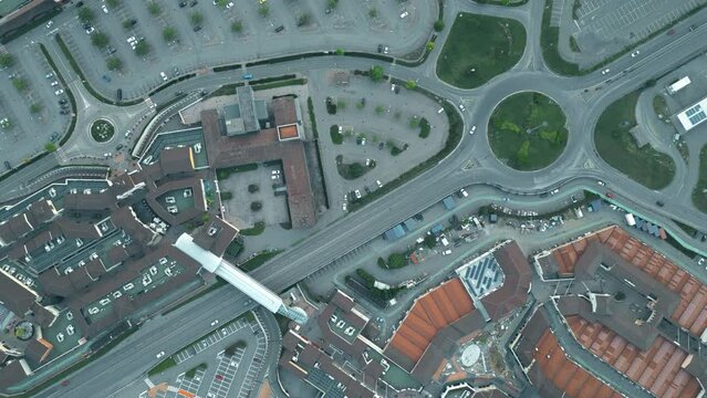 Aerial top down timelapse of a European commercial area full of vacant parking places