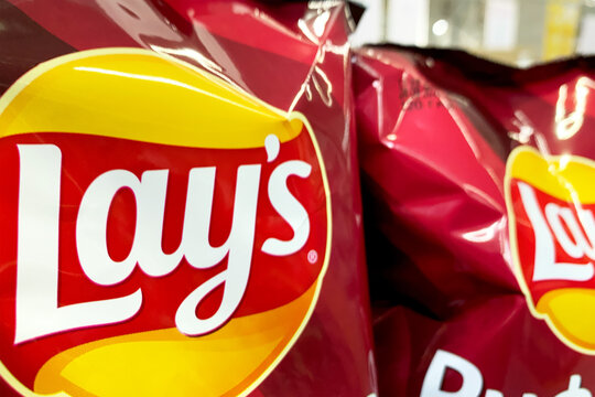 Kyiv, Ukraine 28.07.2023: - Lay's paprika potato chips on display with snacks in supermarket for sale.