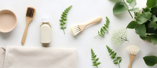 The Zero Waste concept promotes eco-friendly and reusable items such as a cotton eco bag, wooden toothbrushes, paper dishes, and green leaves. is taken from a top view perspective, with items arranged