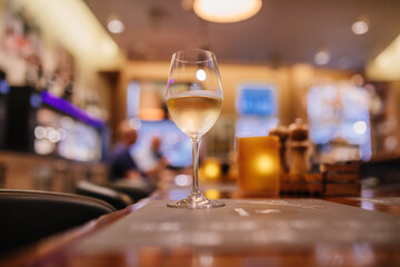 White wine glass on a bar counter