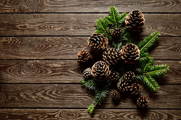 Christmas, Noel or New Year background with Christmas tree on wooden background, festive greeting card, holiday banner with copy space for a text, top down view