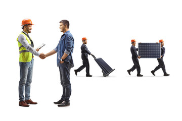 Obraz premium Engineer shaking hand with a young man and workers carrying solar panels