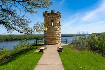 The Julien Dubuque Monument atop a limestone bluff over Mississippi River at the Mines of Spain in Dubuque, Iowa. Julien Dubuque, a Canadian, founded Dubuque as a lead mine in the 1700s. 