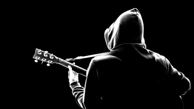 Silhouette of Musician with acoustic guitar