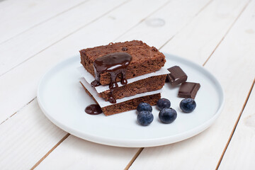 piece of cake with chocolate on a white dish