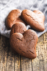 Heart shaped cookies on wooden table.