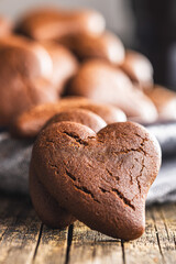 Heart shaped cookies on wooden table.
