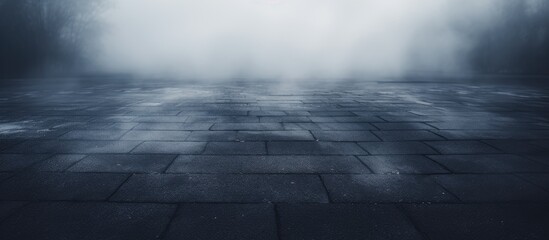 A mist-covered outdoor asphalt background giving a creative and blurry effect.