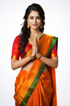 Indian pretty woman in saree in prayer pose or welcoming guests, isolated over white background