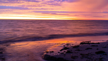 Fototapeta na wymiar Sunrise on an East Coast beach near Gisborne, New Zealand