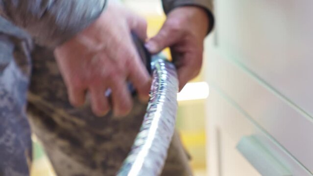 Twisting the tubes and wire the route of split system with foil adhesive tape.