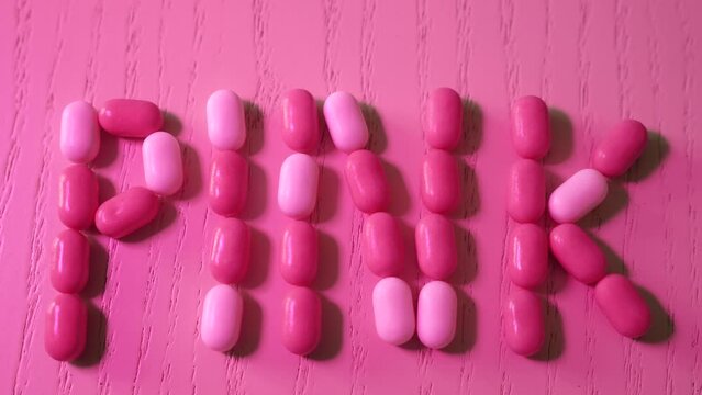The inscription is word pink candy tic tac, Barbie-style close-up, neon lighting.
