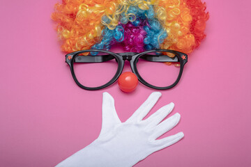 Funny Party concept surprised  face formed with gloves. Rainbow Clown Wig Set with glasses and red...