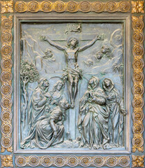 NAPLES, ITALY - APRIL 22, 2023:  The bronze relief of Crucifixion on the gate of church Basilica...