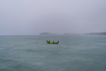 Fishing boat in the fog in Aceh, Indonesia