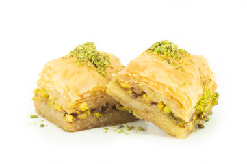 Traditional turkish dessert antep baklava with pistachio isolated on white background. Desserts...
