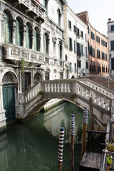 Decorated Pilings by Bridge in Venice