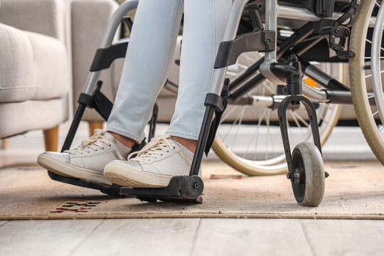 Young woman in wheelchair at home, closeup