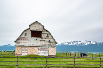 Rural Farm House Barn in Green Countryside of Eastern Oregon With Wallowa Mountains