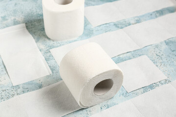 Rolls of toilet paper on blue background