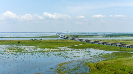 Aerial view of interstate 10 over Mobile Bay on a sunny day in August 2023
