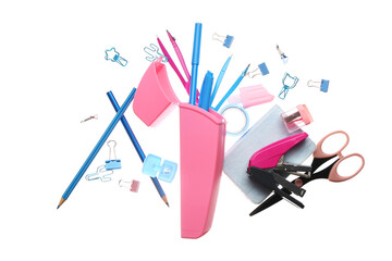 Flying pencil case with different stationery on white background