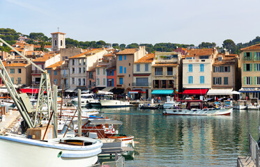 Fototapeta na wymiar Rows of yachts and boats along shore in Cassis, south of France.