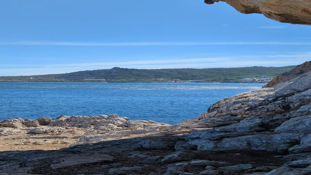 Fishing in the Mediterranean Ocean. A sunny day in Belyounech, Morocco. Blue sky with a clear view, Africa.