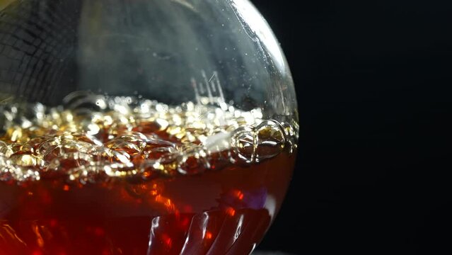 Liquid boils in a laboratory flask. Do drugs in the lab. Slow motion