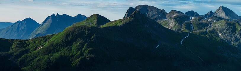 Horizontal high resolution panorama of green luscious details in Norwegian mountains seen from...